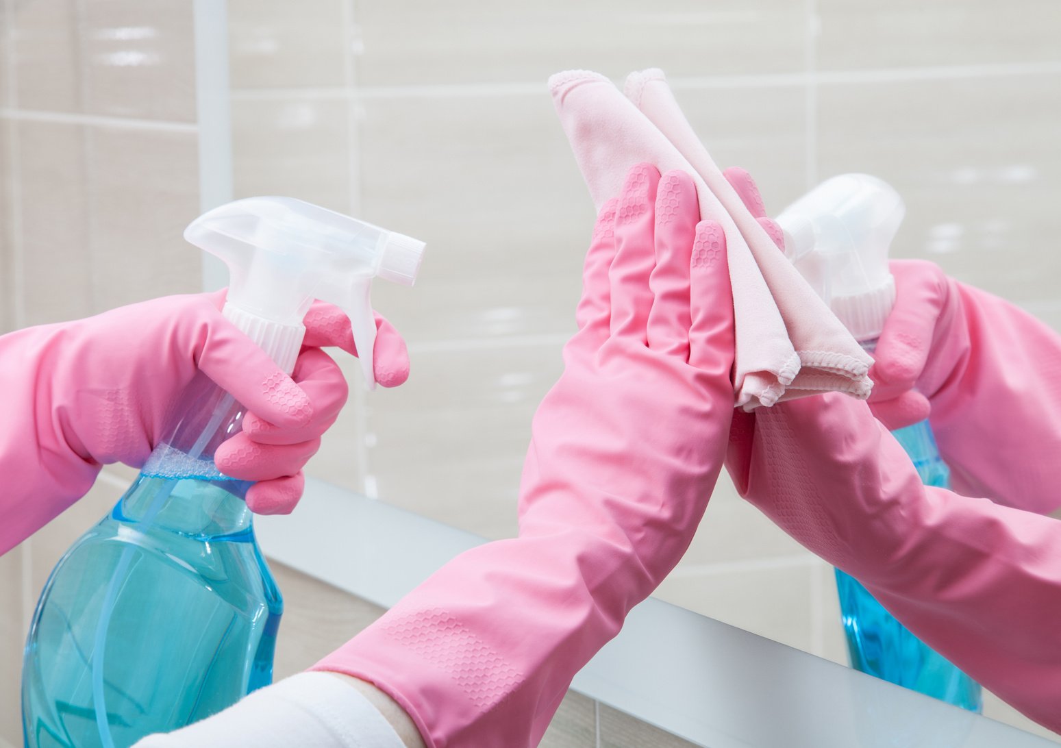 Housemaid cleaning a bathroom